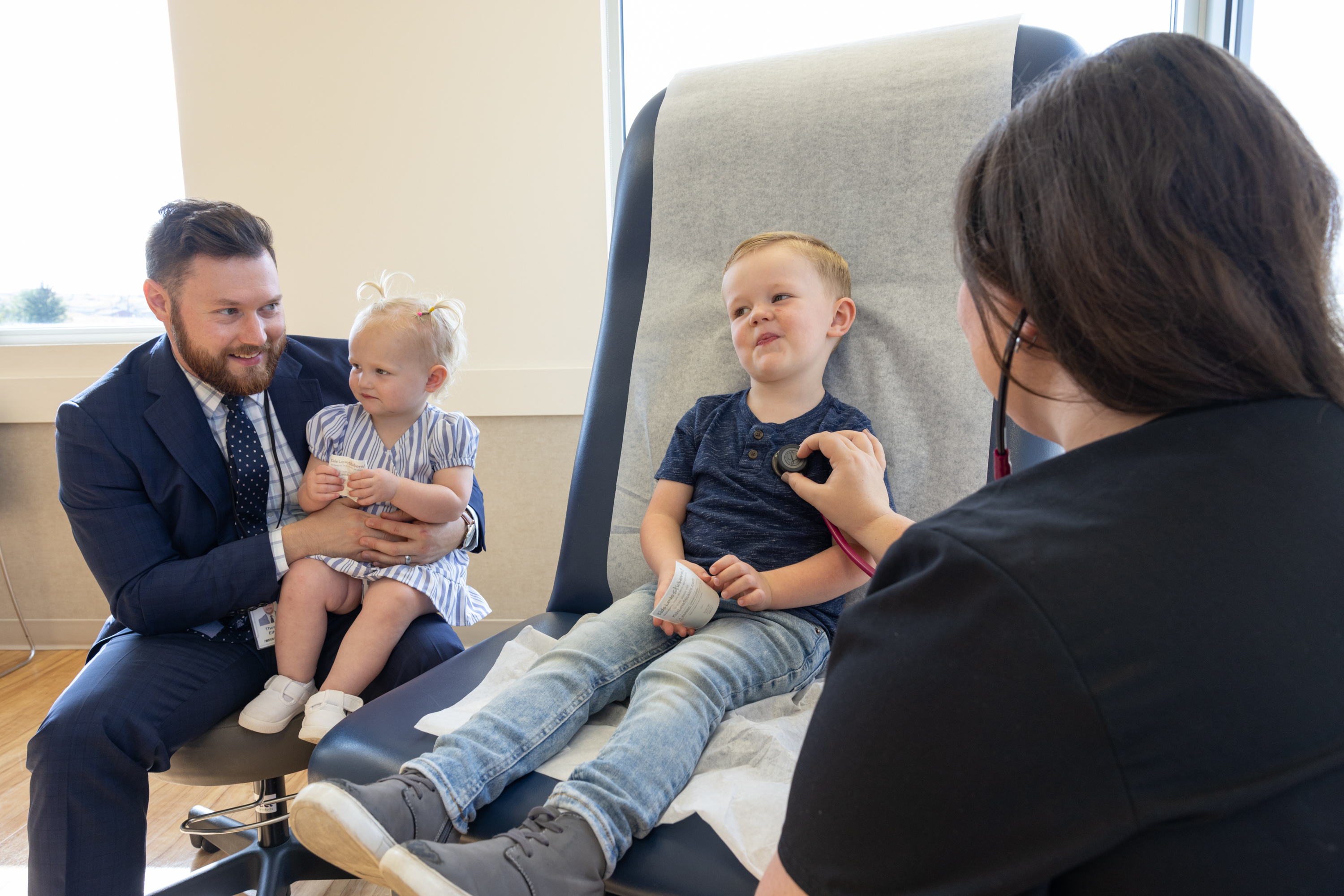 Nurse with family checkup